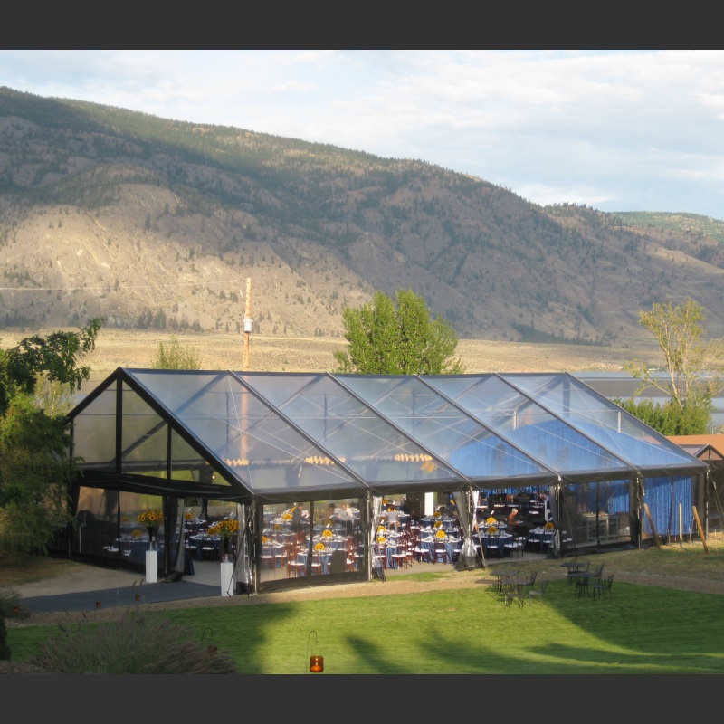 Clear span tent, Corporate event in Okanagan - La Stella Winery | guests 101~200 | 50 x 75 black clear maxi frame with clear gables and clear walls.| Elevation Tent Rentals