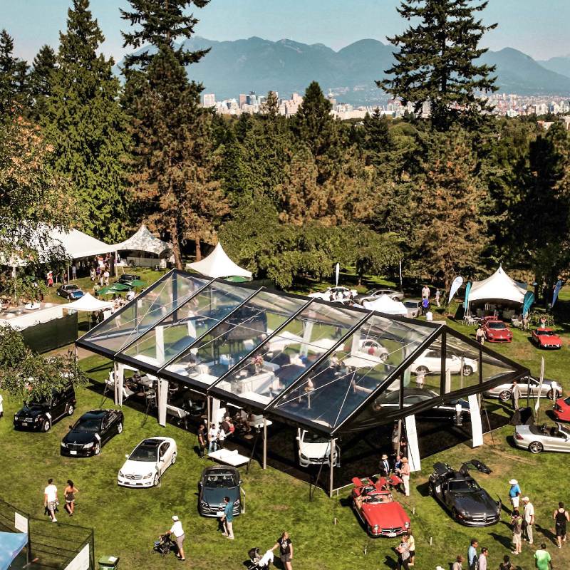 Clear span tent, Festival event in Vancouver - Mercedes Benz Car Show | guests 101~200 | 50 x 75 black clear maxi frame. with multiple small tents surrounding. This tent was used as the main tent for feature cars to be displayed.| Elevation Tent Rentals